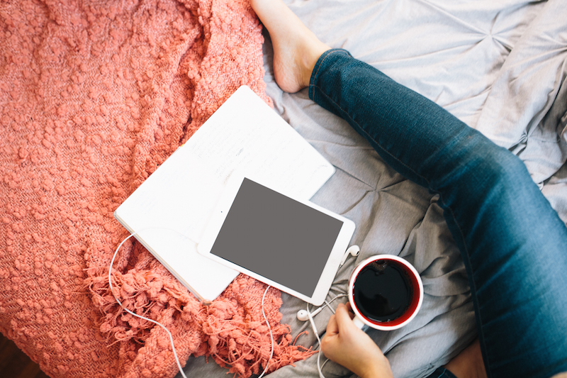 woman drinking coffee with ipad mini