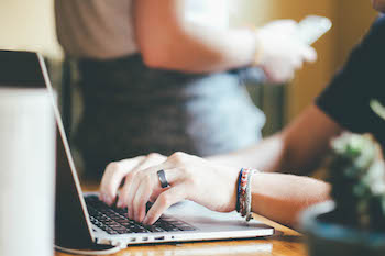 Photo: Someone typing on a computer