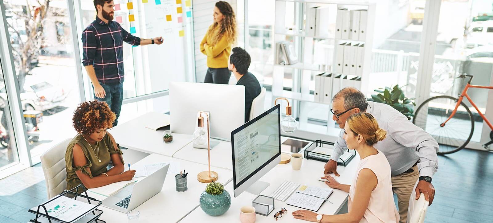 A group of employees working in an office space.