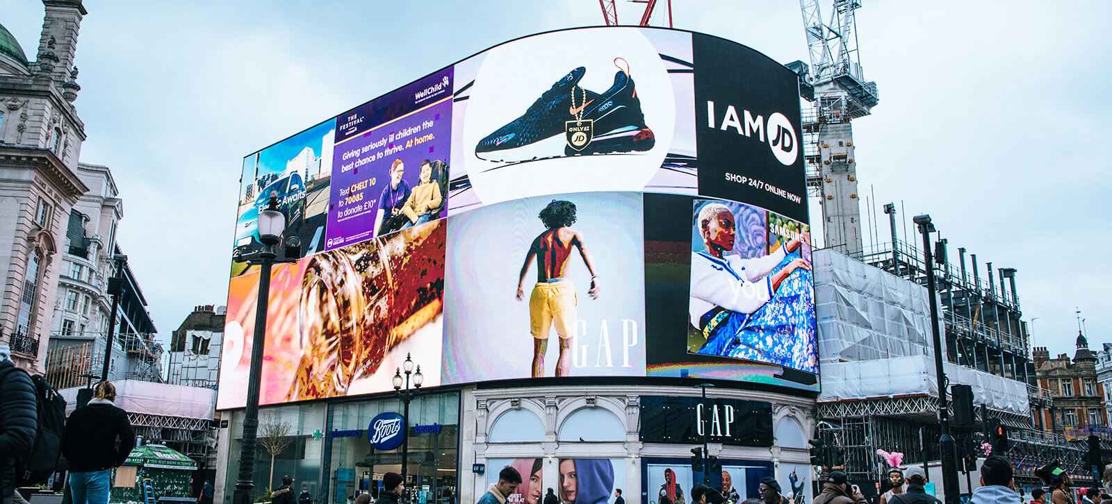 A building covered with digital advertisements