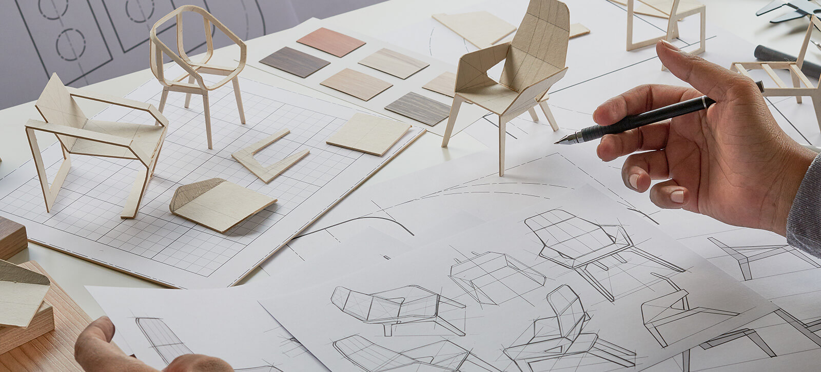 Sketches and small wood models of a chair