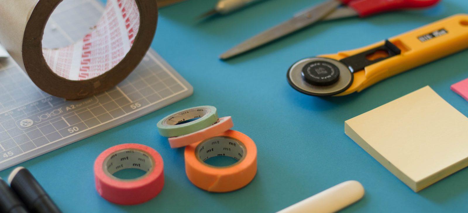 assorted-color office items on table