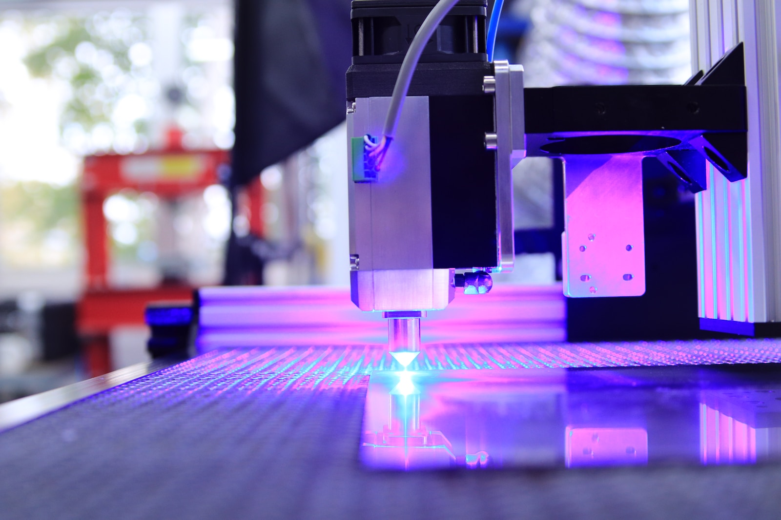 purple and white led light on 3d printing machine